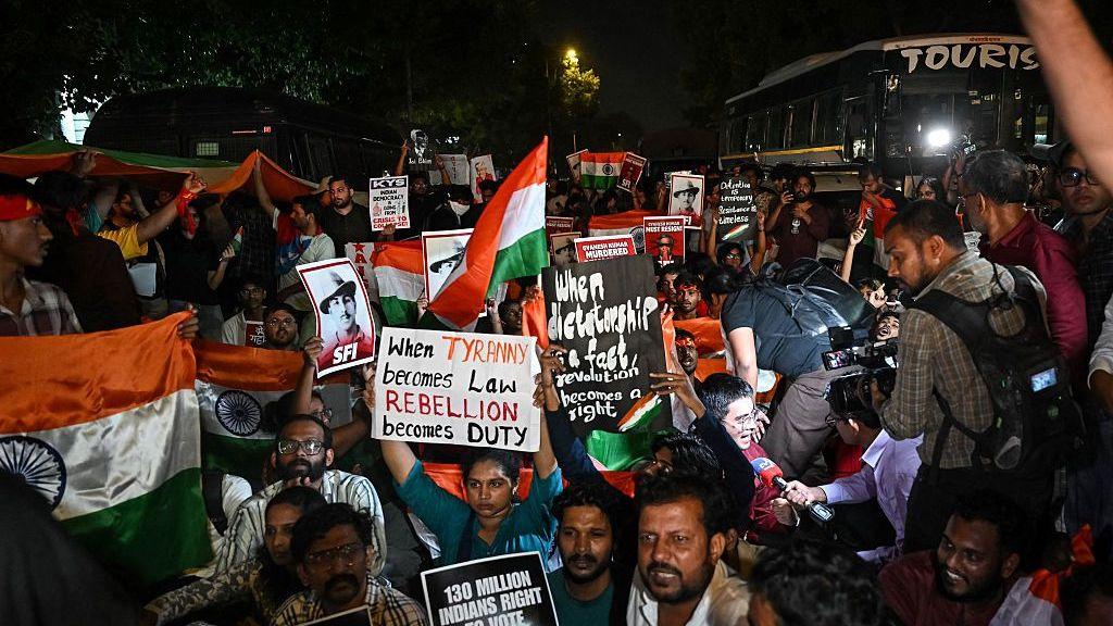Cockroach Janta Party (CJP) supporters holding the country's national flags protest, demanding India's Chief Election Commissioner Gyanesh Kumar's resignation over alleged voter roll irregularities linked to the "special intensive revision" (SIR), at Connaught Place in New Delhi on October 16, 2026.