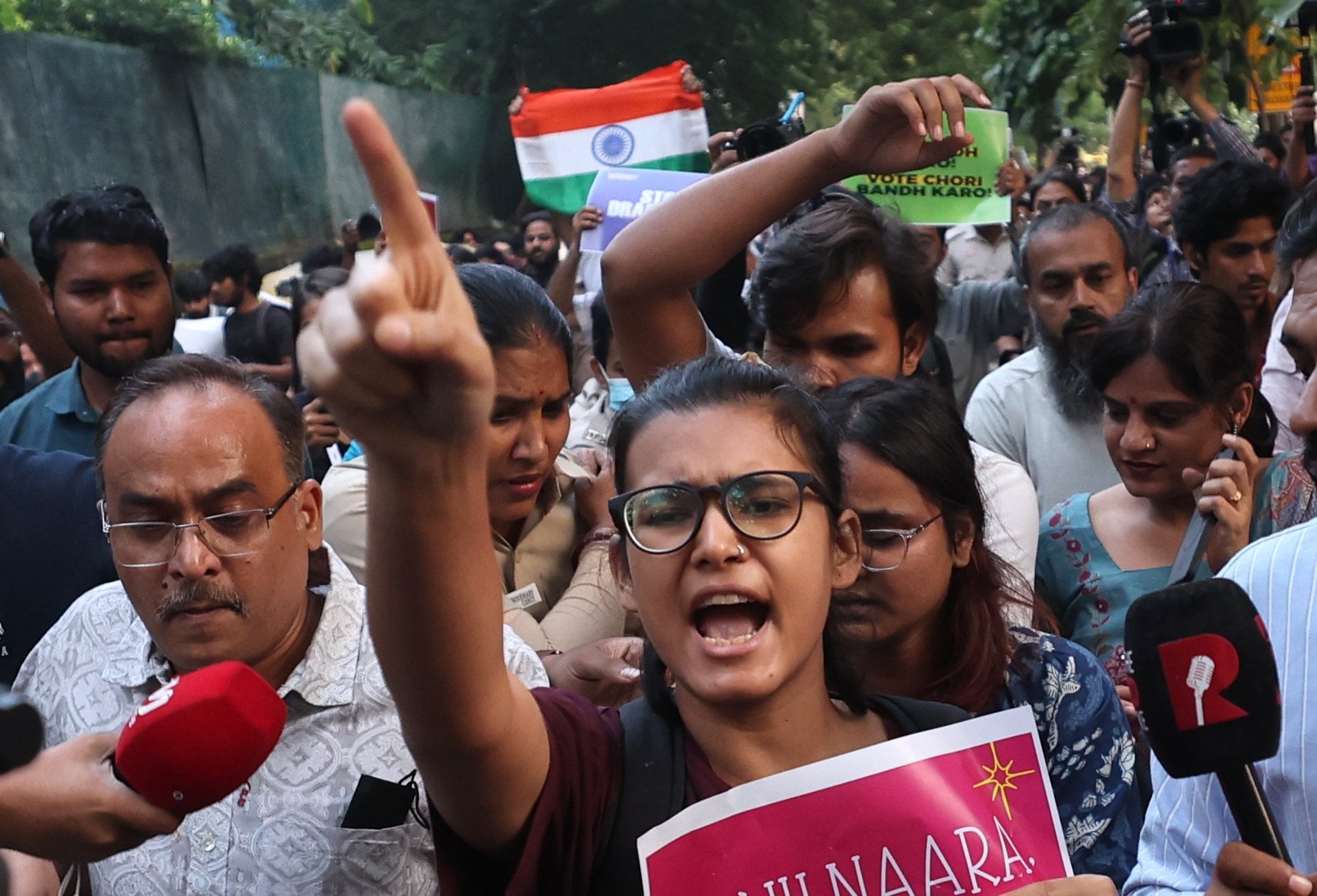 All India Students’ Association National President Neha Bora takes part in a tricolour march in New Delhi on Friday. Photo: EPA