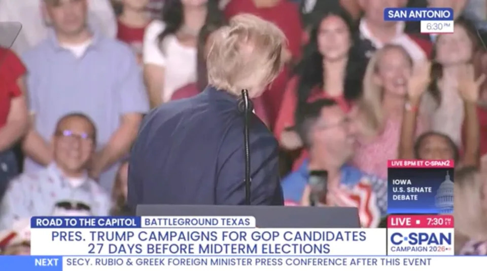 Donald Trump checks his hair during a speech in Texas. / C-SPAN