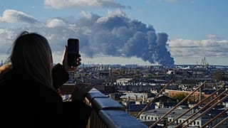 Smoke billows into the sky following Ukrainian drone strikes on an industrial zone in St. Petersburg, Russia, on Sunday, Oct. 18, 2026
