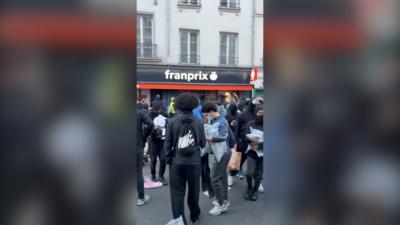 Masked protesters seen looting shops in Paris