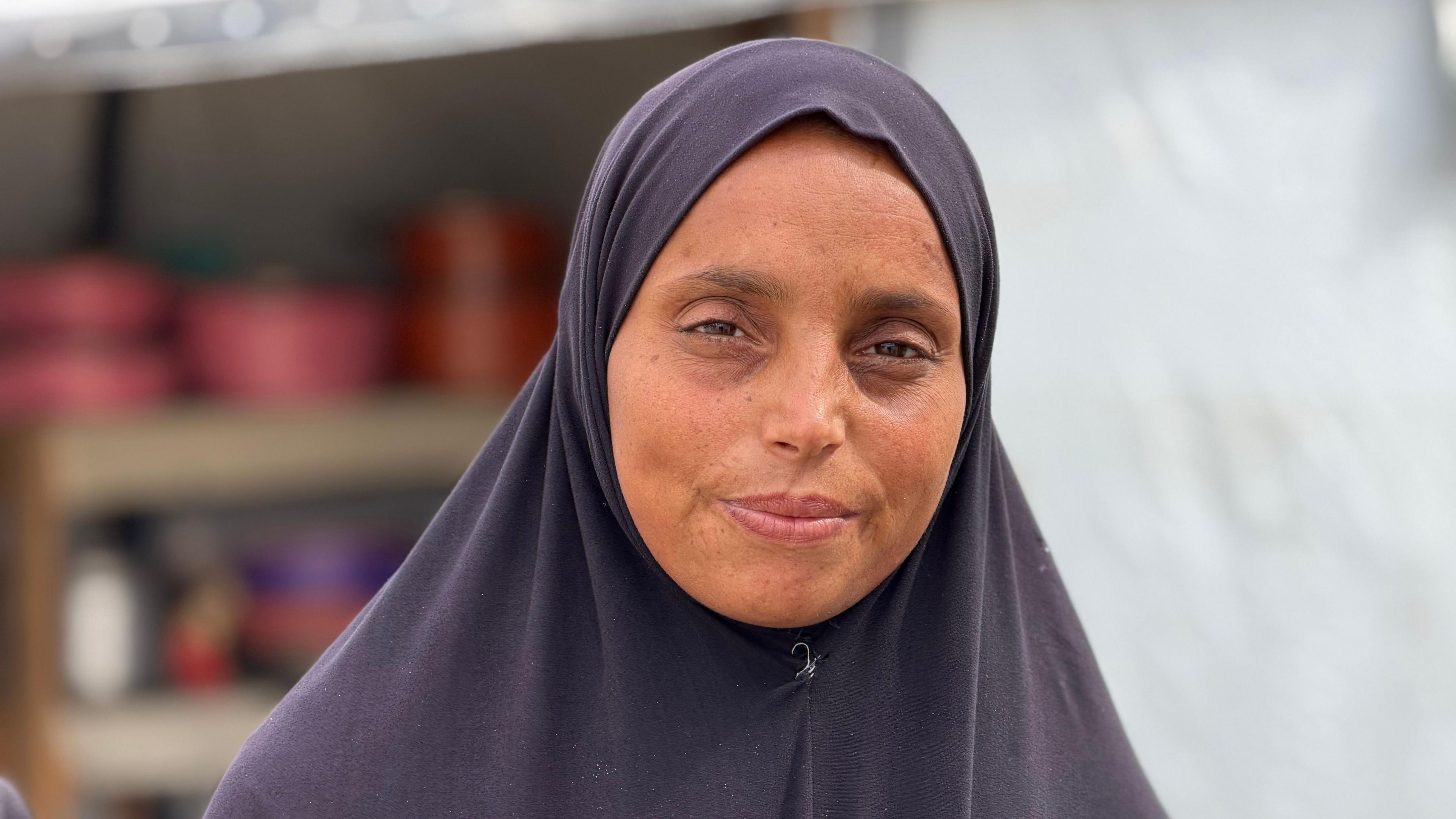Mervat al-Satari in front of a tent in al-Mawasi, southern Gaza