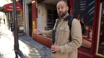 James Waterhouse outside smashes store front