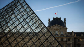 The french flag flutters on the Louvre museum in Paris, Wednesday Feb. 25, 2026