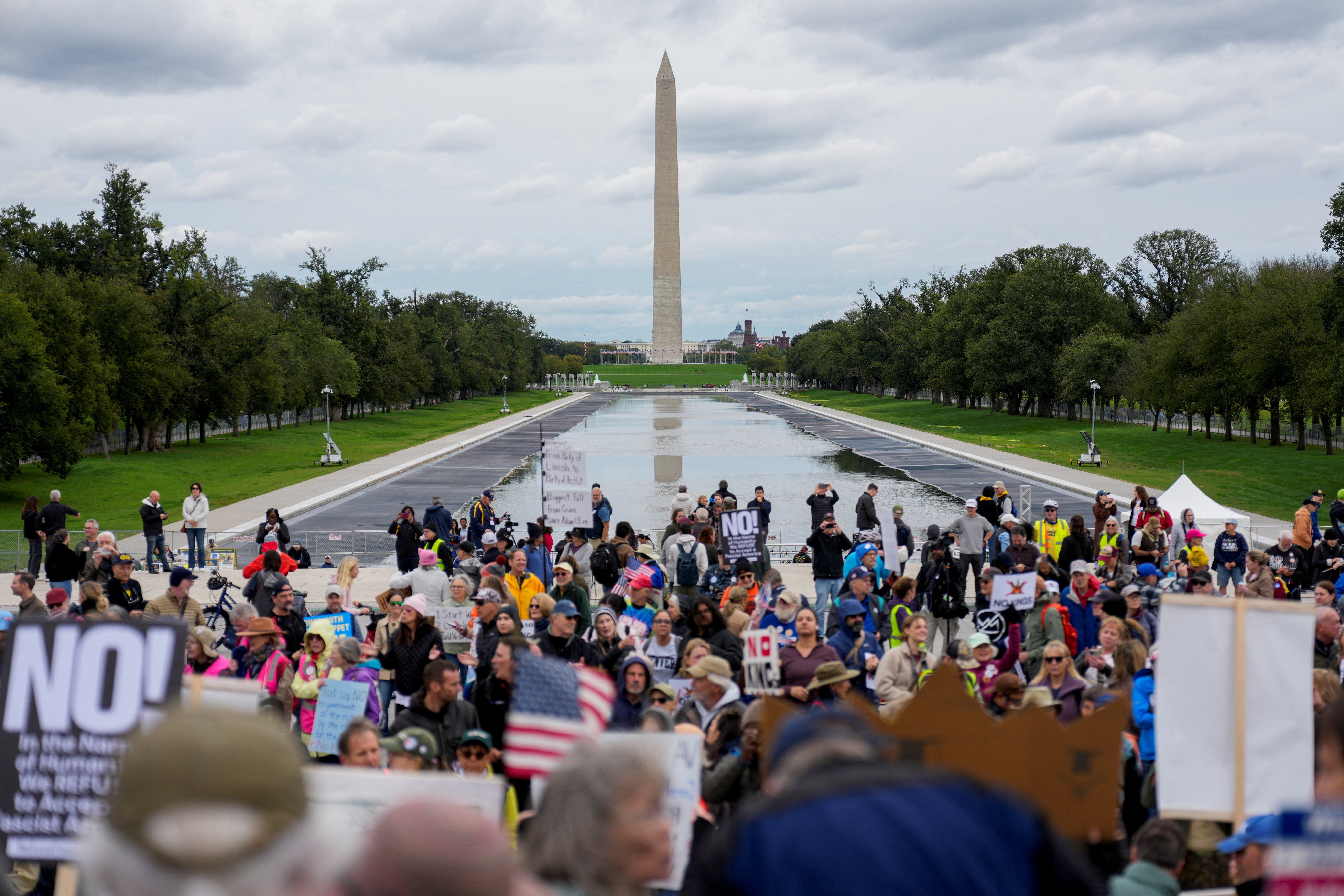 ‘Washington’s beautiful Reflecting Pool, which was badly damaged by Vandals despite the ridiculous writings of some Radical Left person in the D.C. U.S. Attorney’s Office who got it wrong and obviously didn’t investigate, witness, or see the attached tape, or the very inspiring Jesse Watters show which explained it all,’ Trump ranted in his post. No Kings protesters are pictured at the partially filled pool over the weekend
