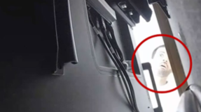 A still from a CCTV image of the alleged suspect Abdulrahman Alfozan peering behind the back of a TV in a room