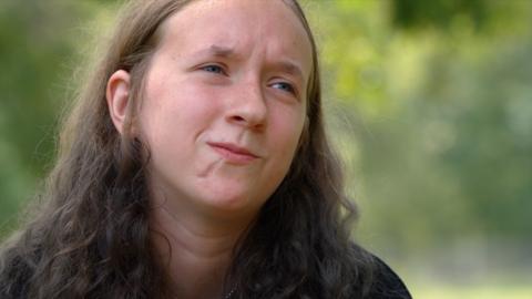 A close up of Abby, with long brown hair