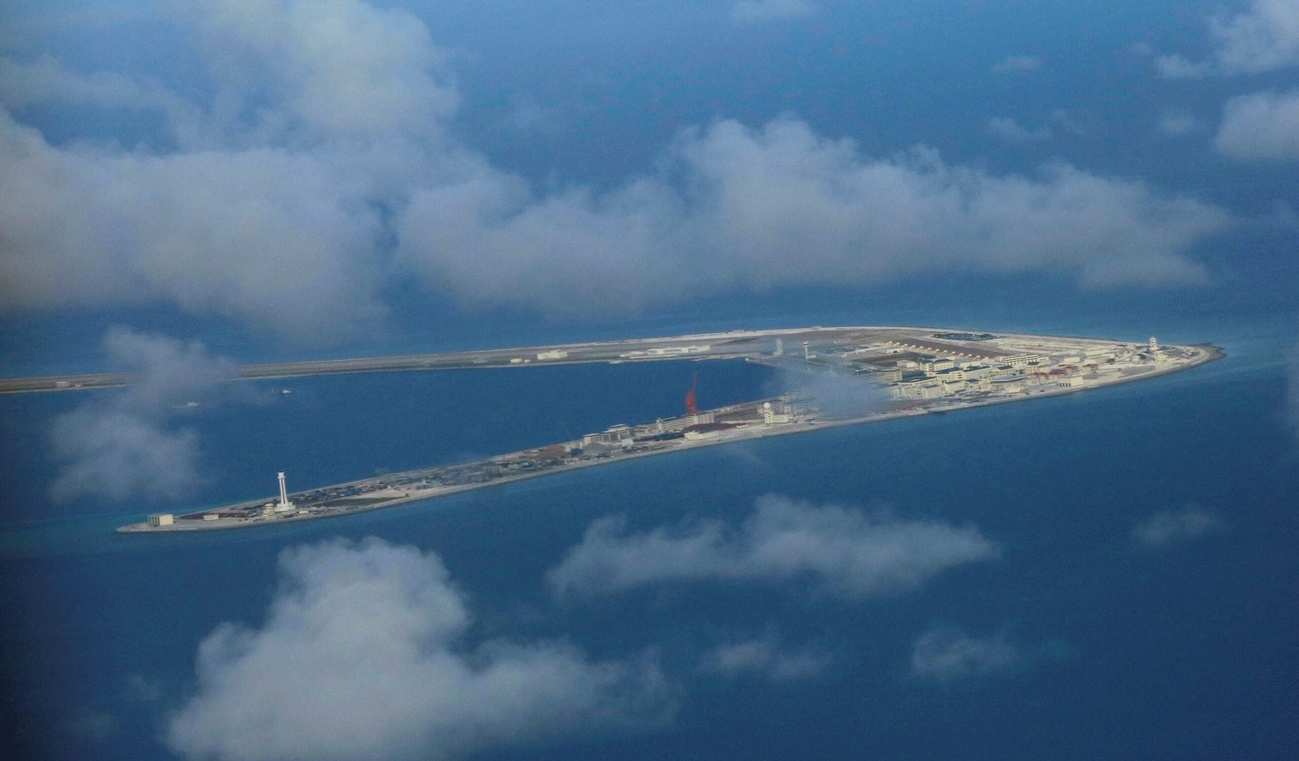 China Sends Naval Forces to Monitor US Warship Near Disputed Shoal