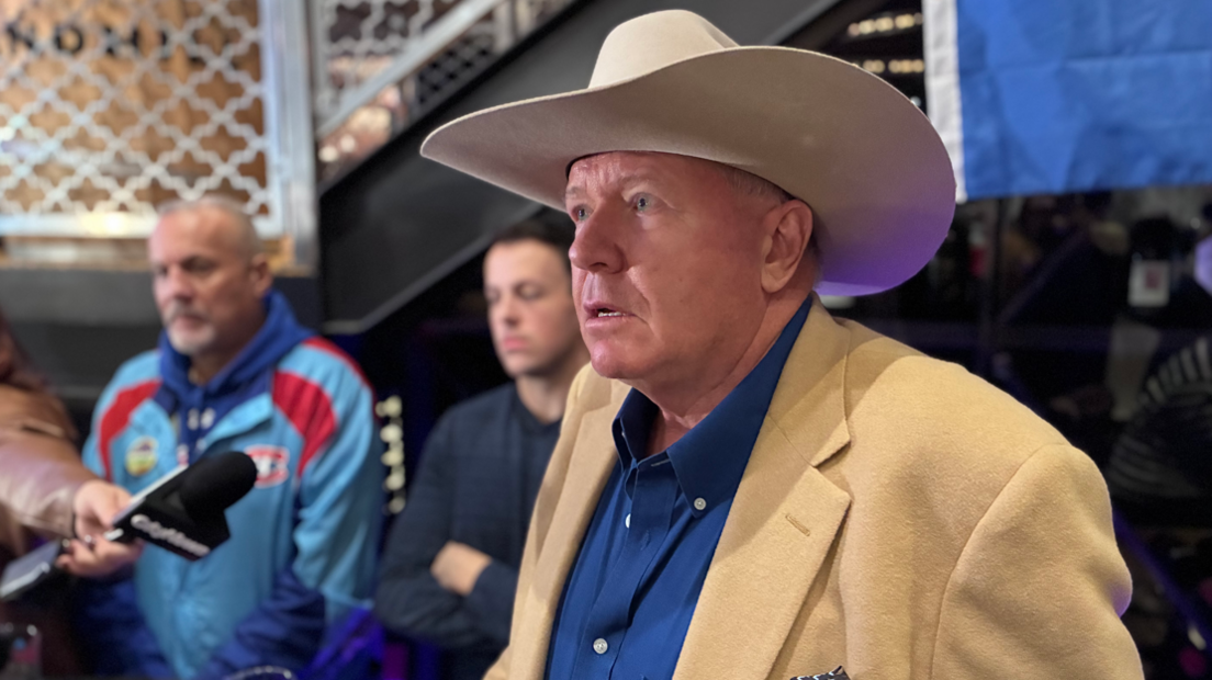 Wearing a matching cream-coloured hat and jacket, Jeffrey Rath appears at a watch party overnight after an independence vote in Alberta
