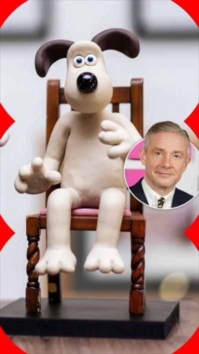 A plasticine sits in a chair