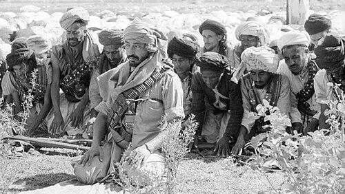 Muhammad al-Badr praying with his guards Muhammad al-Badr praying with his guards