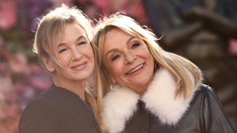 Renée Zellweger (left) and Helen Fielding pictured together while attending the Bridget Jones Scenes in the Square statue unveiling at Leicester Square, London in 2025