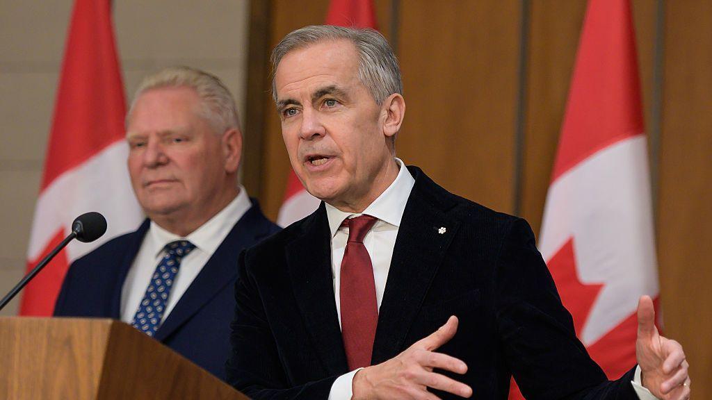 Mark Carney, Canada's prime minister, right, and Doug Ford, Ontario's premier, during a news conference in Ottawa, Ontario, Canada, on Thursday, Dec. 18, 2025. 