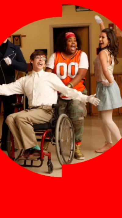 Members of the original cast of glee singing in a classroom.