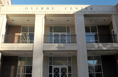 Exterior of building. Signage says "overby center"