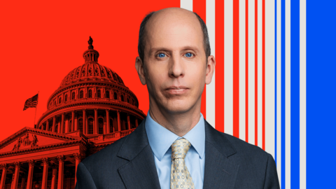A cut of of Anthony Zurcher wearing a suit and tie in front of a red, black, grey and blue graphic background featuring the US Capitol Building 