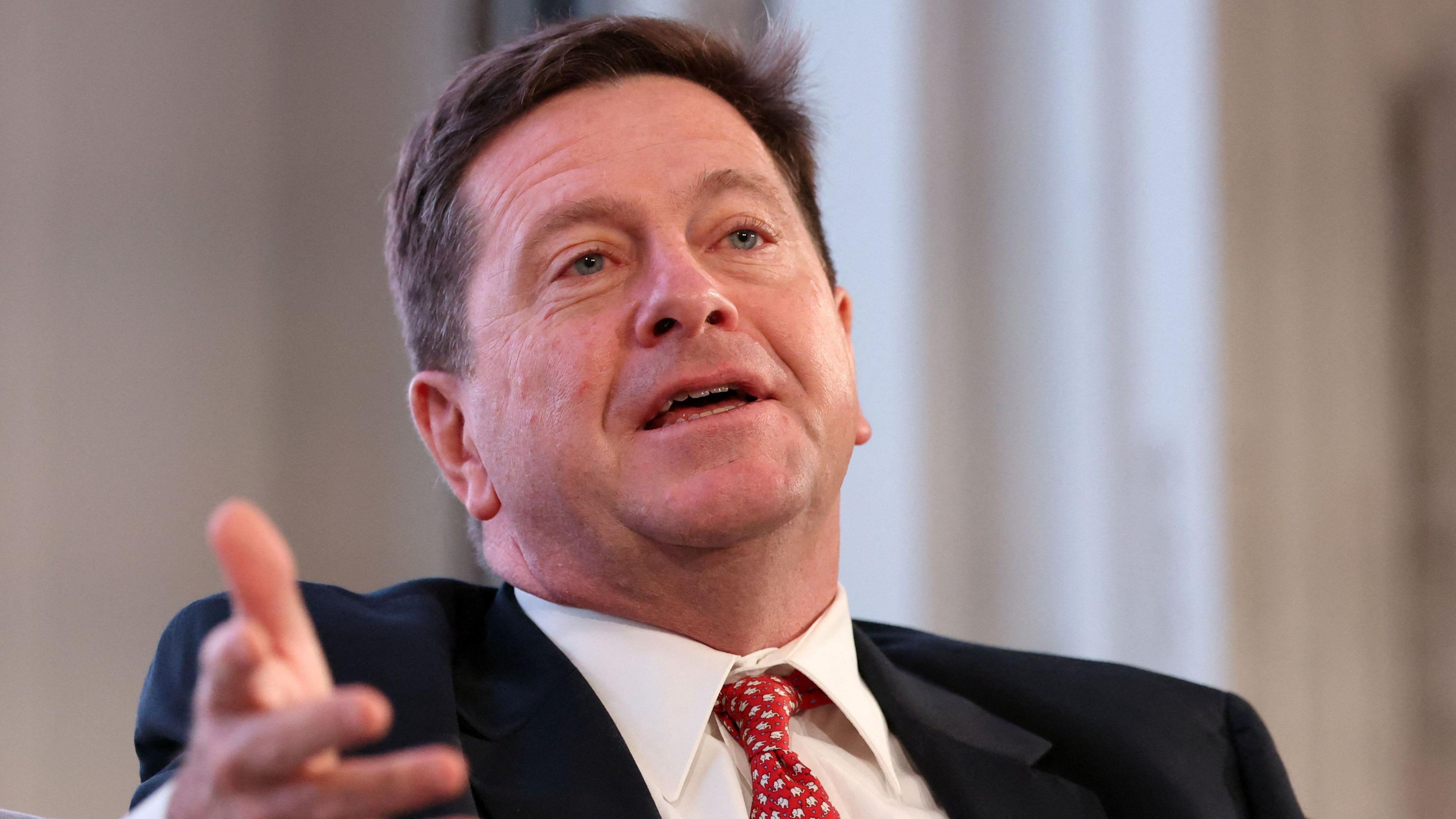 Jay Clayton gestures with his right hand 