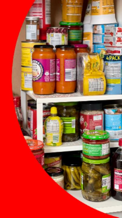 Piled canned food, including tuna, beans and sauces.