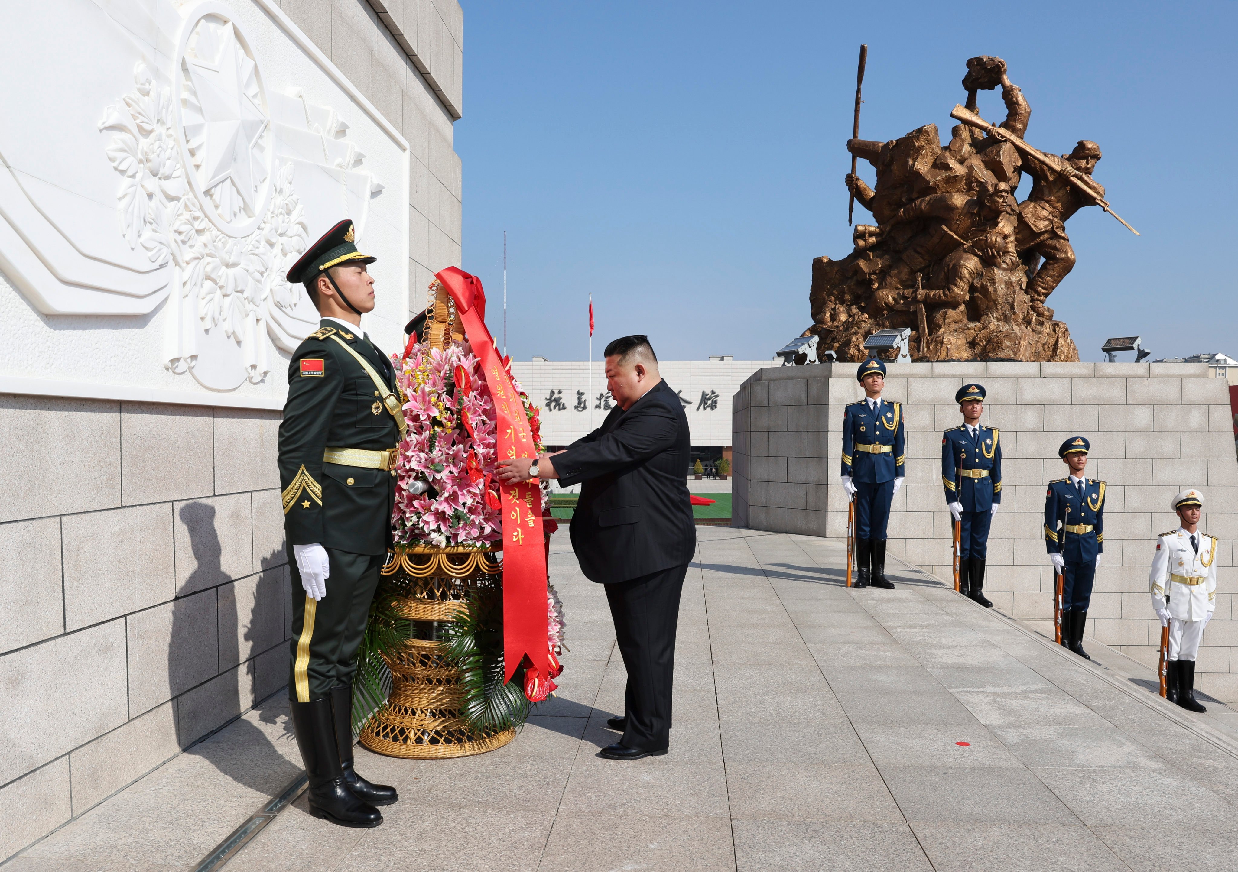 Kim Jong-un offers a floral tribute at the Monument to the War to Resist US  Aggression and Aid Korea. Photo: Xinhua
